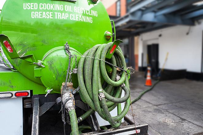 a pump truck emptying a grease trap in Channelview